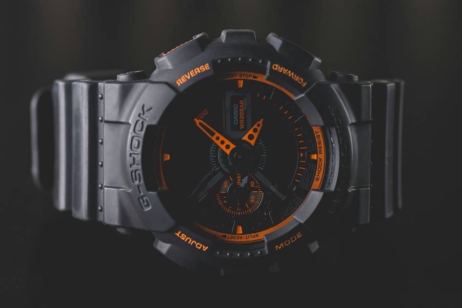 Editor wearing a sleek fashion smartwatch while reviewing tech specs