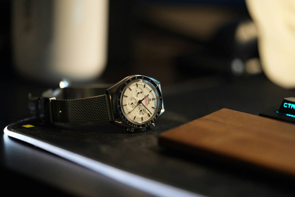 new trending watches for men displayed on a wooden surface with minimalist dials and leather straps