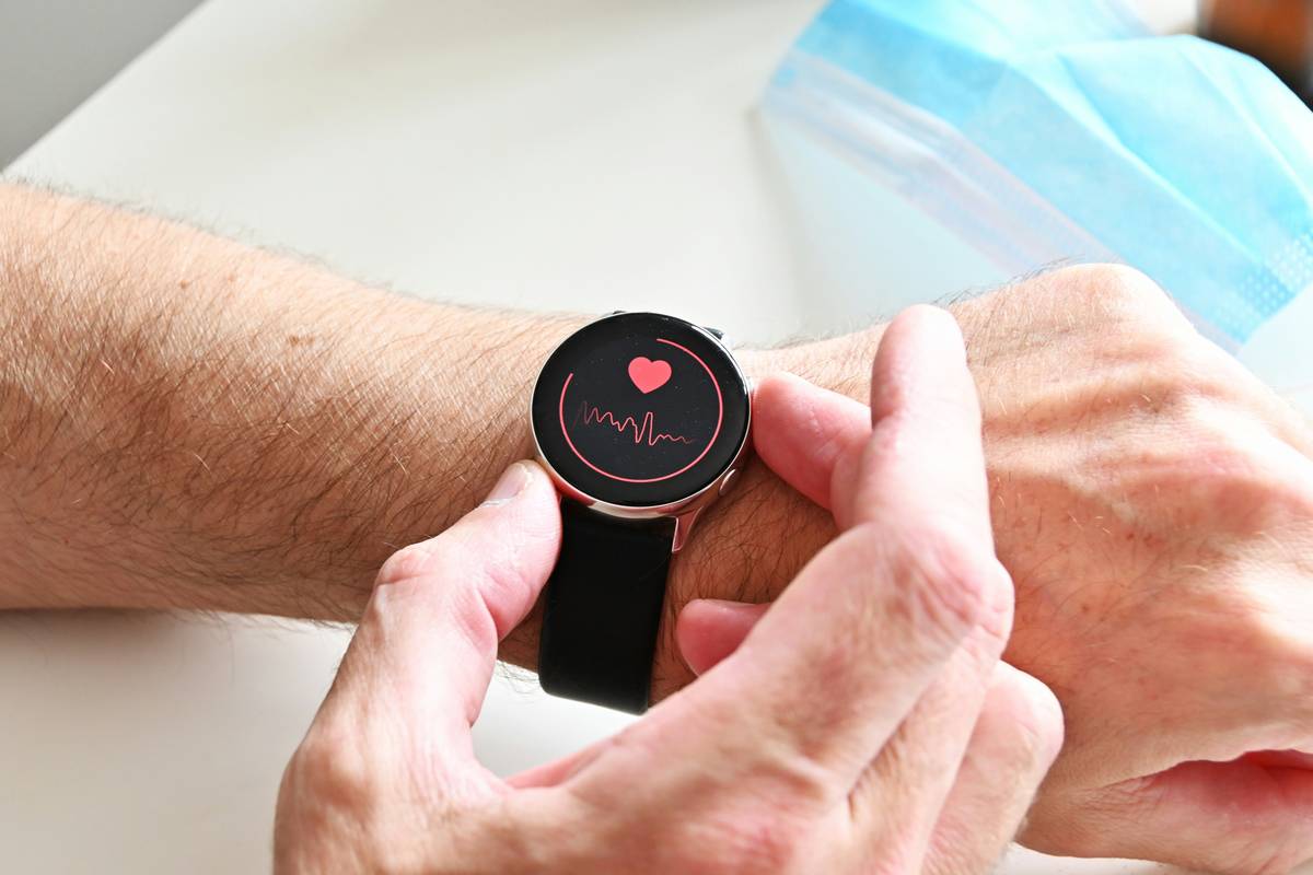 Fitness Tracking Integration shown on a stylish analog-digital hybrid watch displaying heart rate and steps